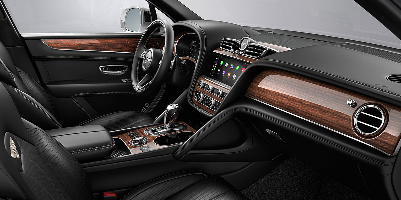 Bentley Taipei Bentley Bentayga interior with a Crown Cut Walnut veneer, view from the passenger seat over looking the driver's seat.