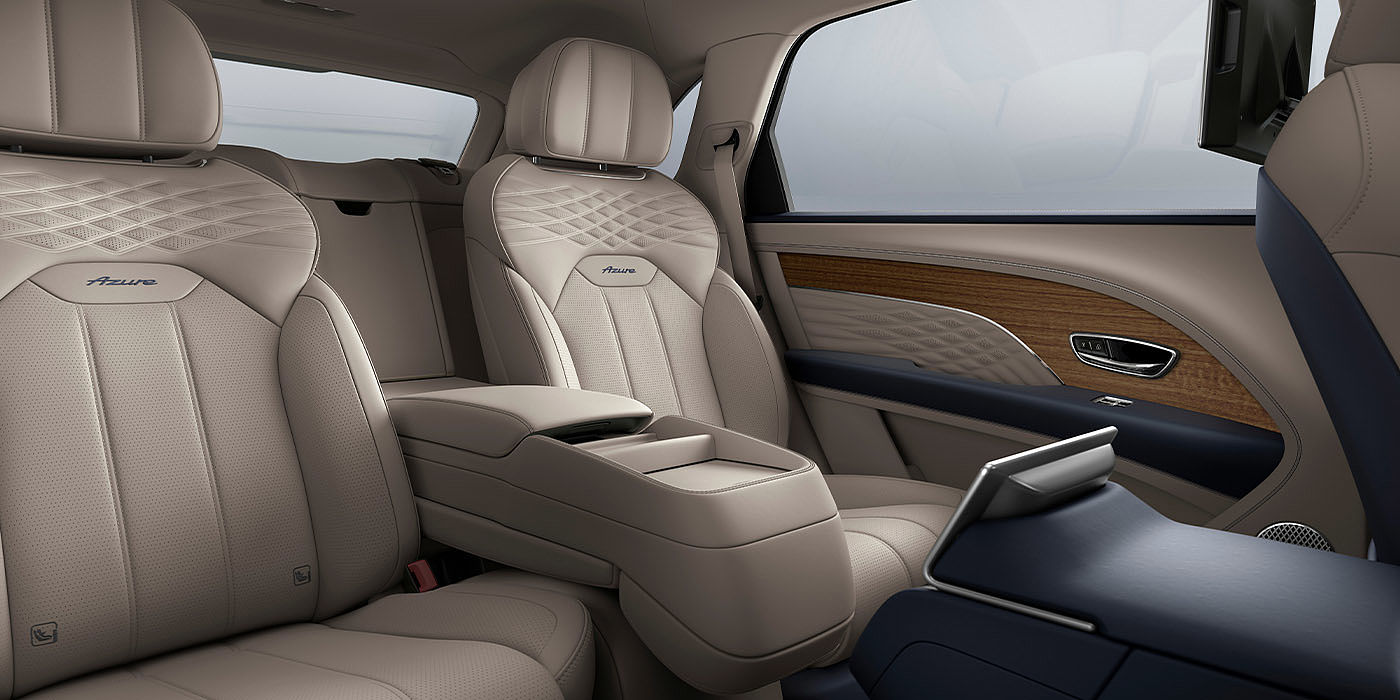 Bentley Taipei Bentley Bentayga EWB Azure interior view for rear passengers with Portland hide featuring Azure Emblem in Imperial Blue contrast stitch.