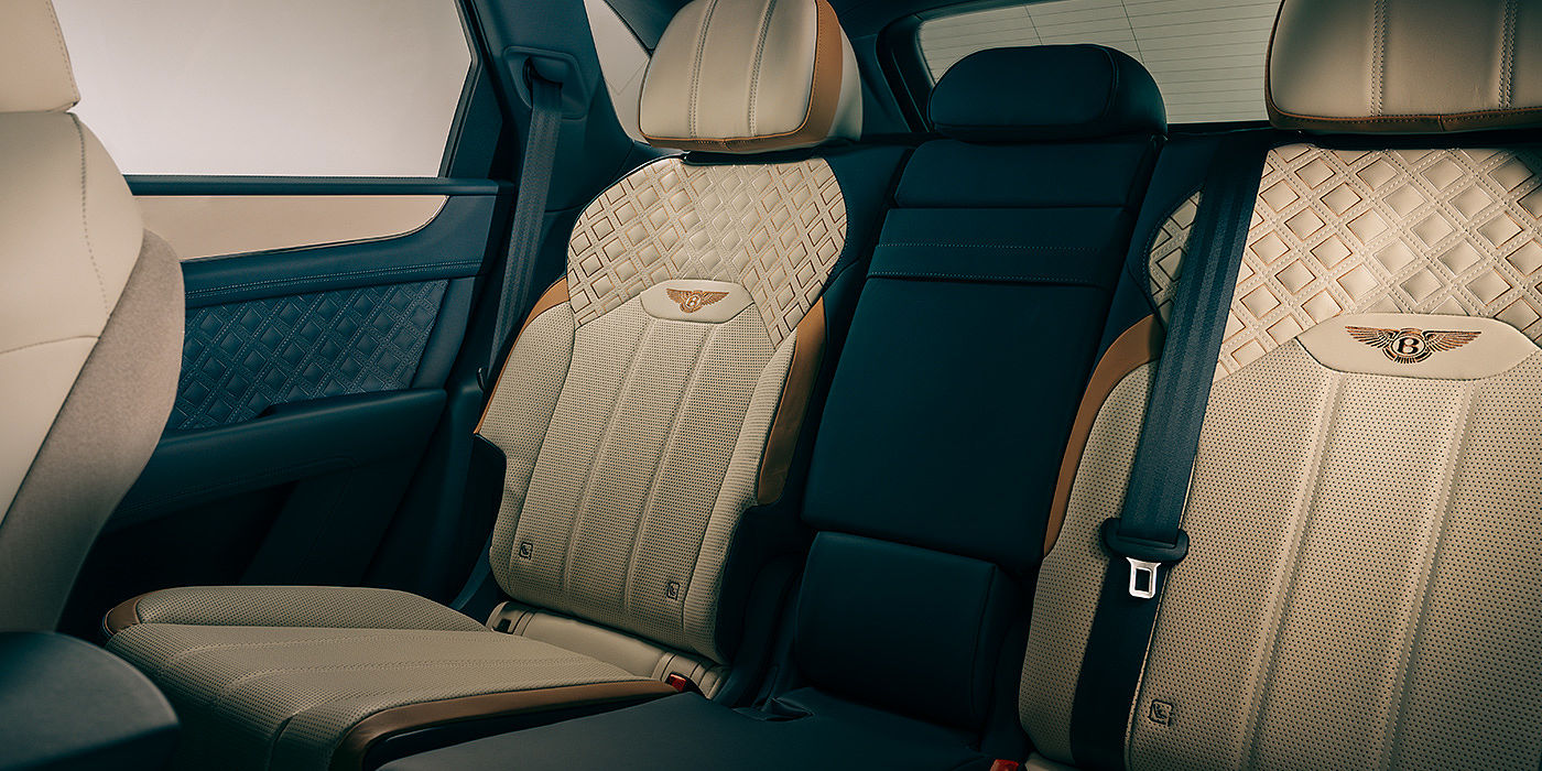 Bentley Taipei Bentley Bentayga Odyssean Edition SUV rear interior in Linen and Brunel hides with diamond in diamond seat stitching