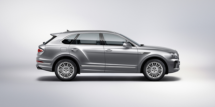 Bentley Taipei Bentley Bentayga SUV side profile in Moonbeam silver paint against white background featuring 21 inch 5 spoke wheels